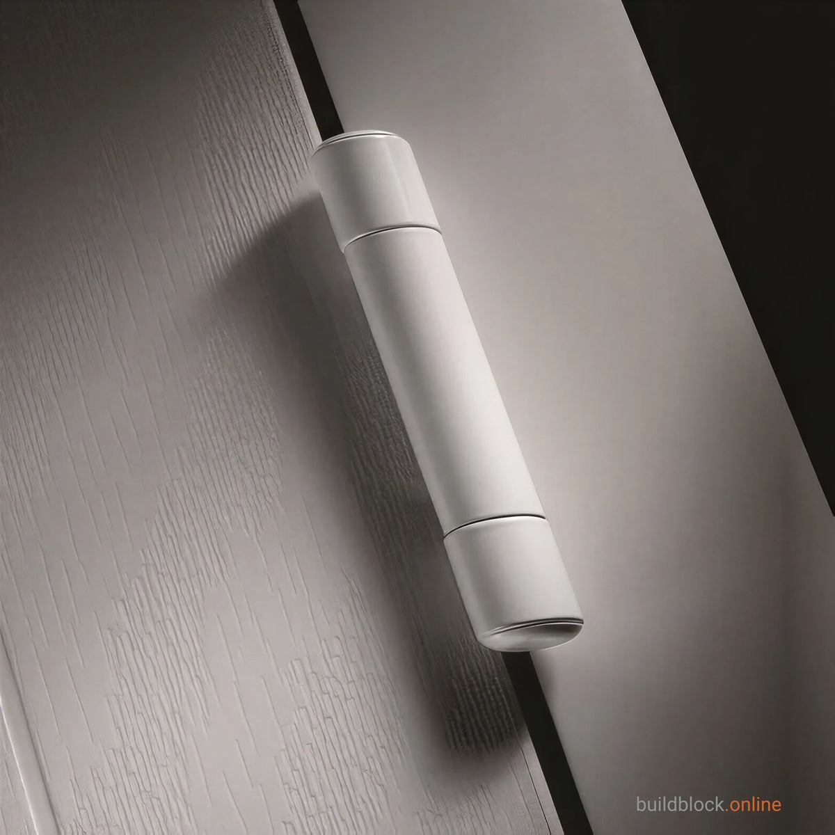 A white SFS hinge barrel cover fitted on a white uPVC door.